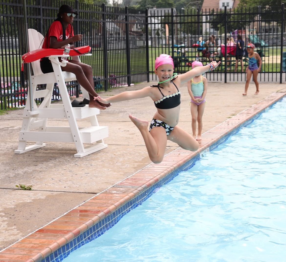 Girl jumping in the pool